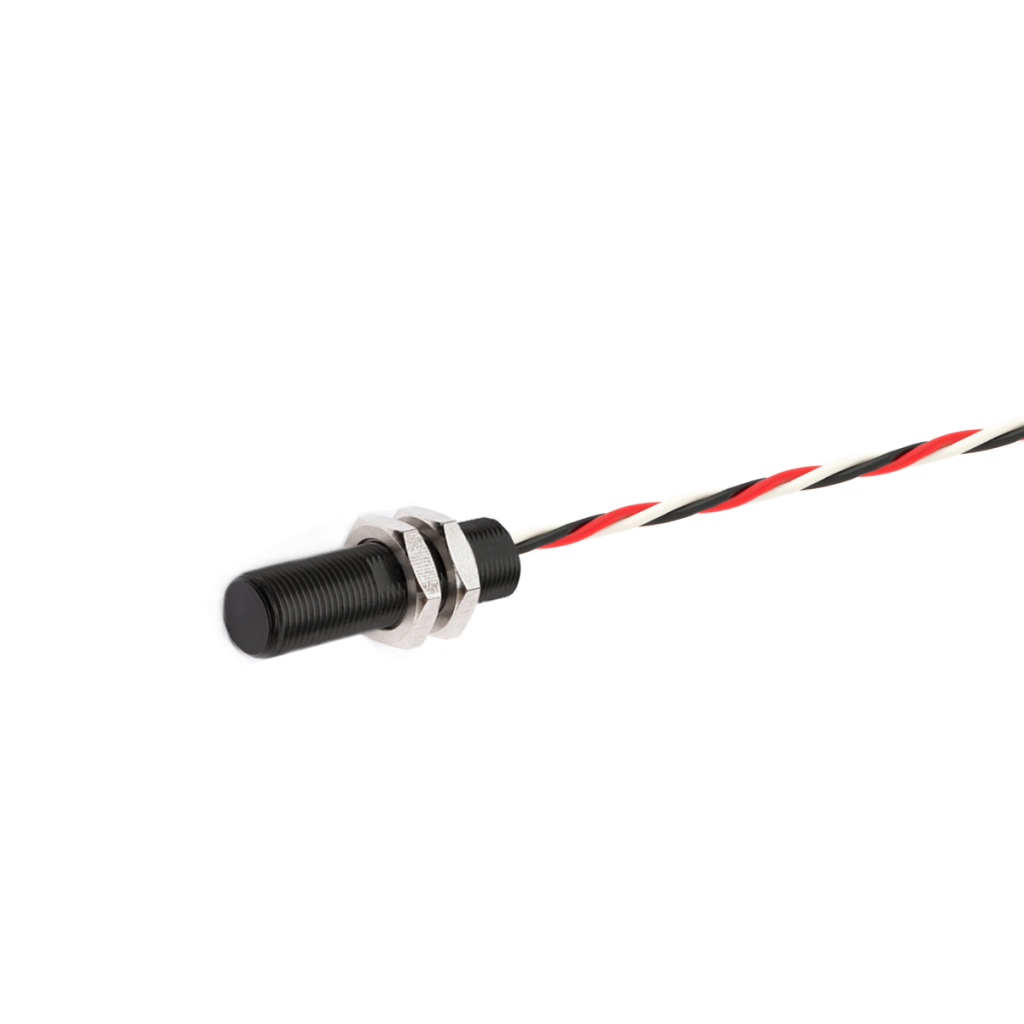 A cylindrical black Hall Effect sensor with a threaded body, secured by two hex nuts, is attached to a red, black, and white twisted cable, isolated on a white background. by Standex Detect