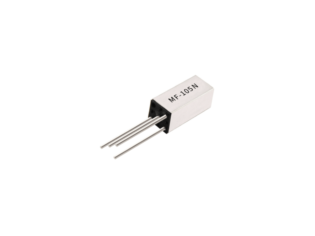 A small rectangular electronic component from the MF Series with four metal pins and the label MF-105N printed on its silver casing, this Reed Relay is isolated on a white background. by Standex Detect