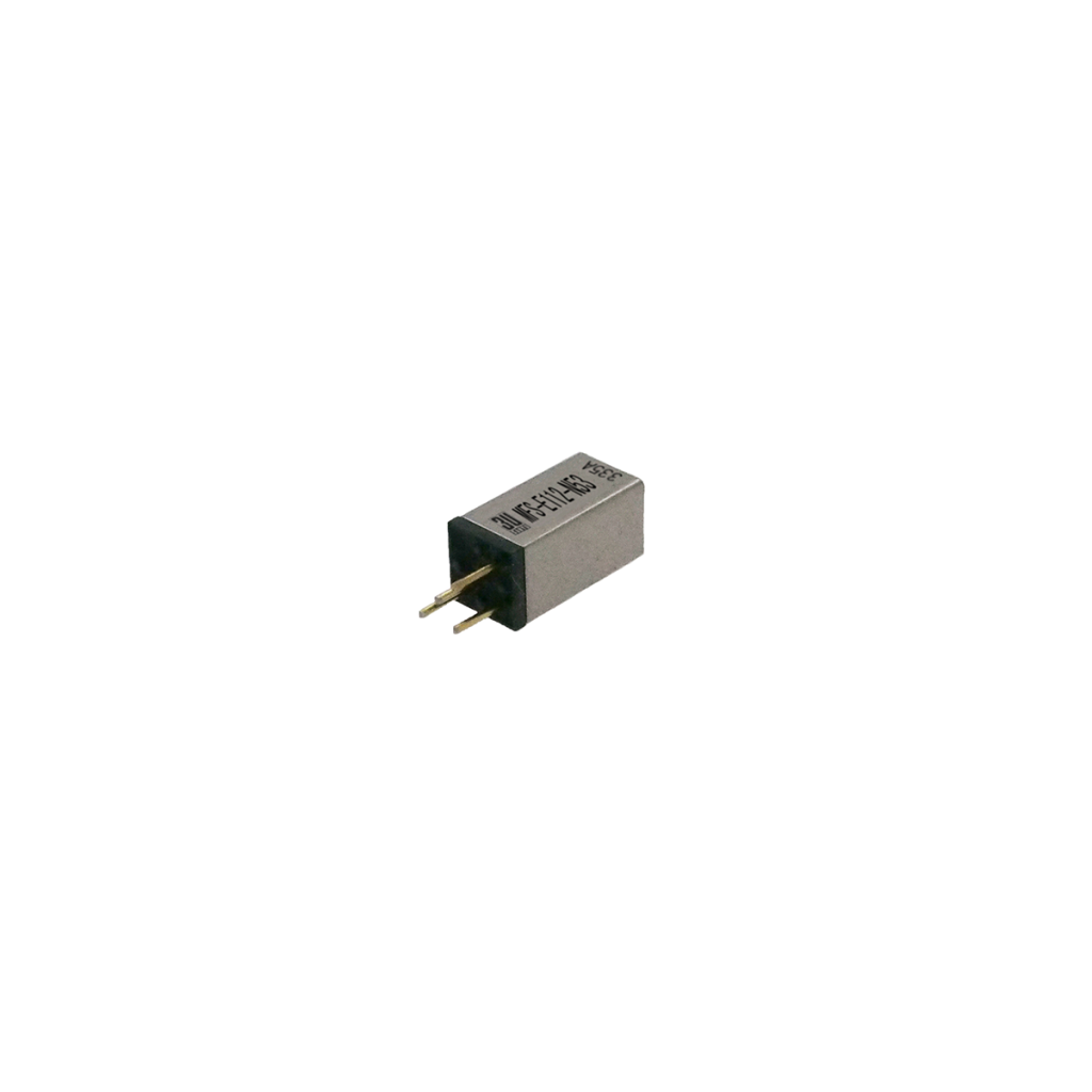 A small rectangular electronic component, such as a Reed Switch from the MFS Series, with two metal pins and black and grey casing, positioned against a white background. by Standex Detect