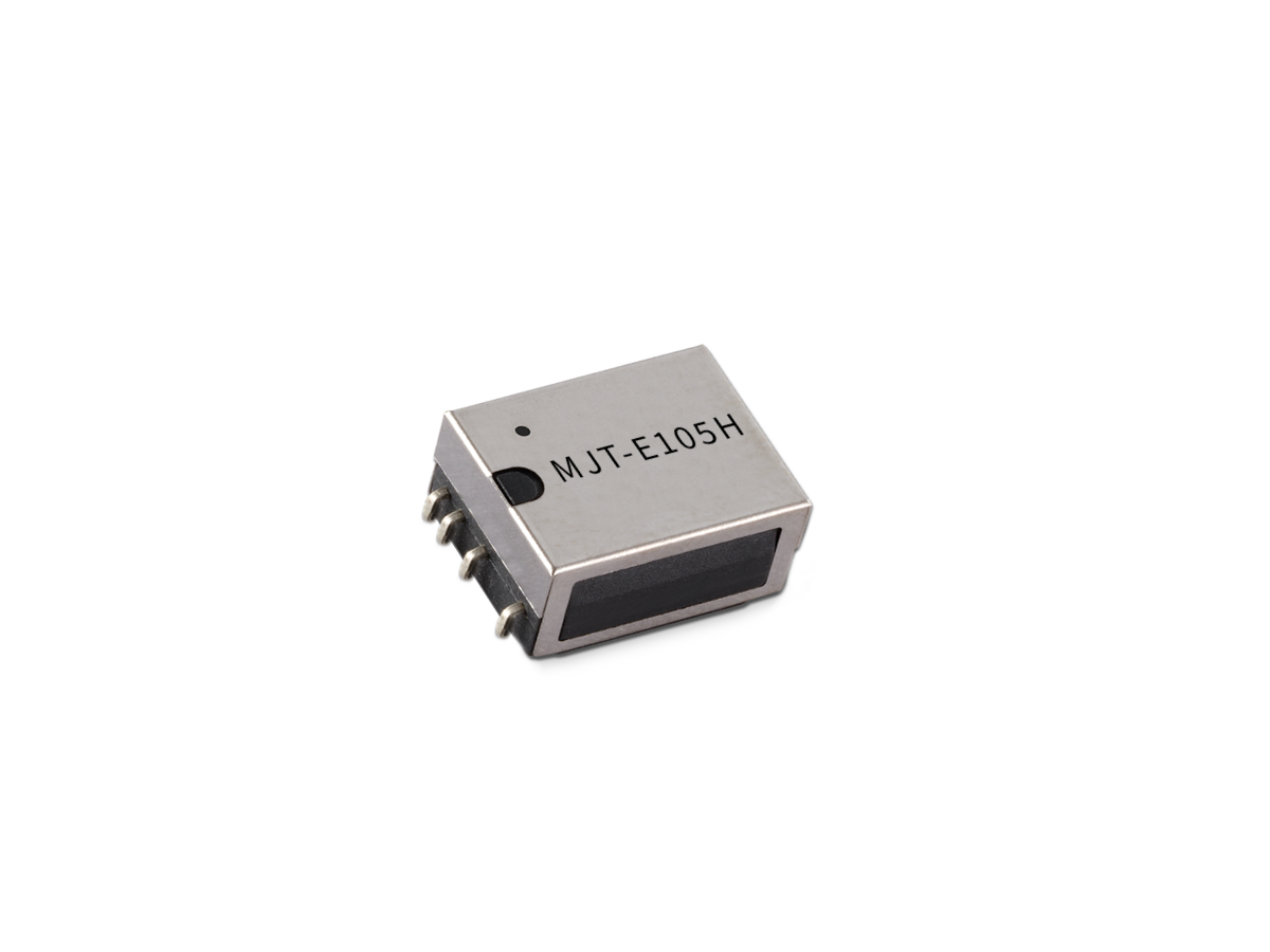 A small rectangular MT Series Reed Relay electronic component with five metal pins and the label “MJT-E105H” printed on the top, isolated on a white background. by Standex Detect