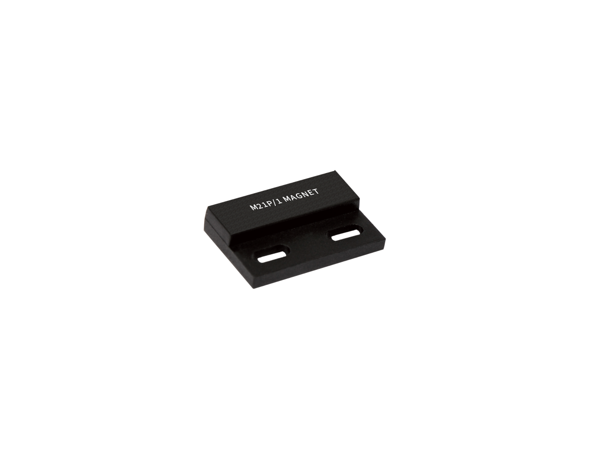 A small, rectangular black metal component labeled M2LPI MAGNET from the M21P Series Magnet collection, featuring two elongated mounting holes and displayed on a white background. by Standex Detect